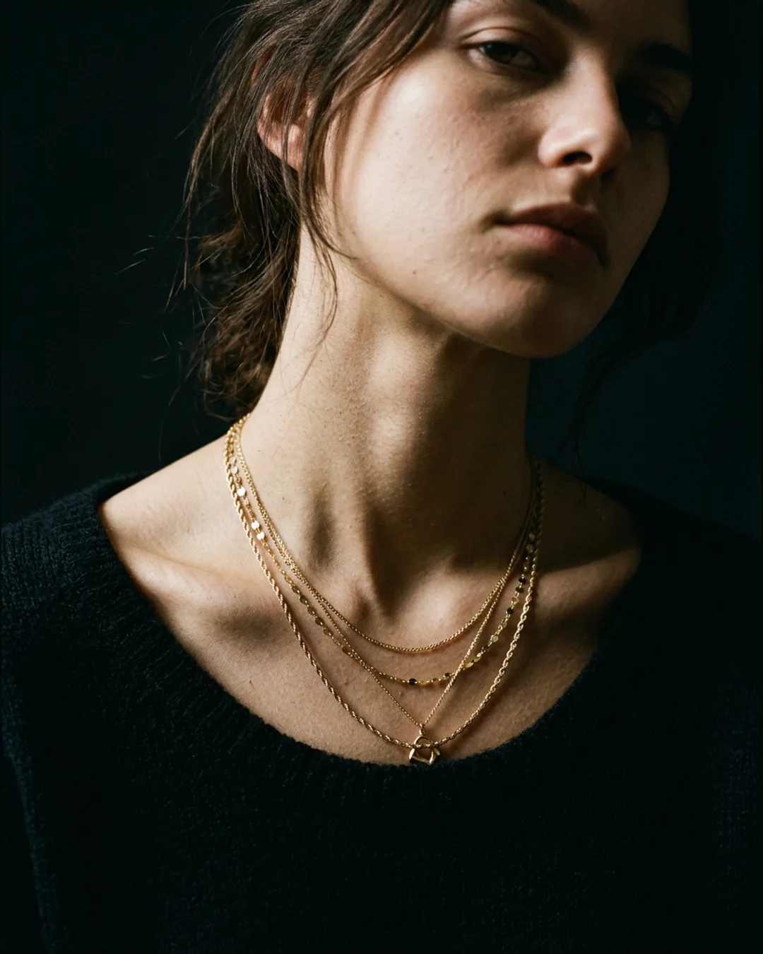 Editorial neck portrait with layered chains